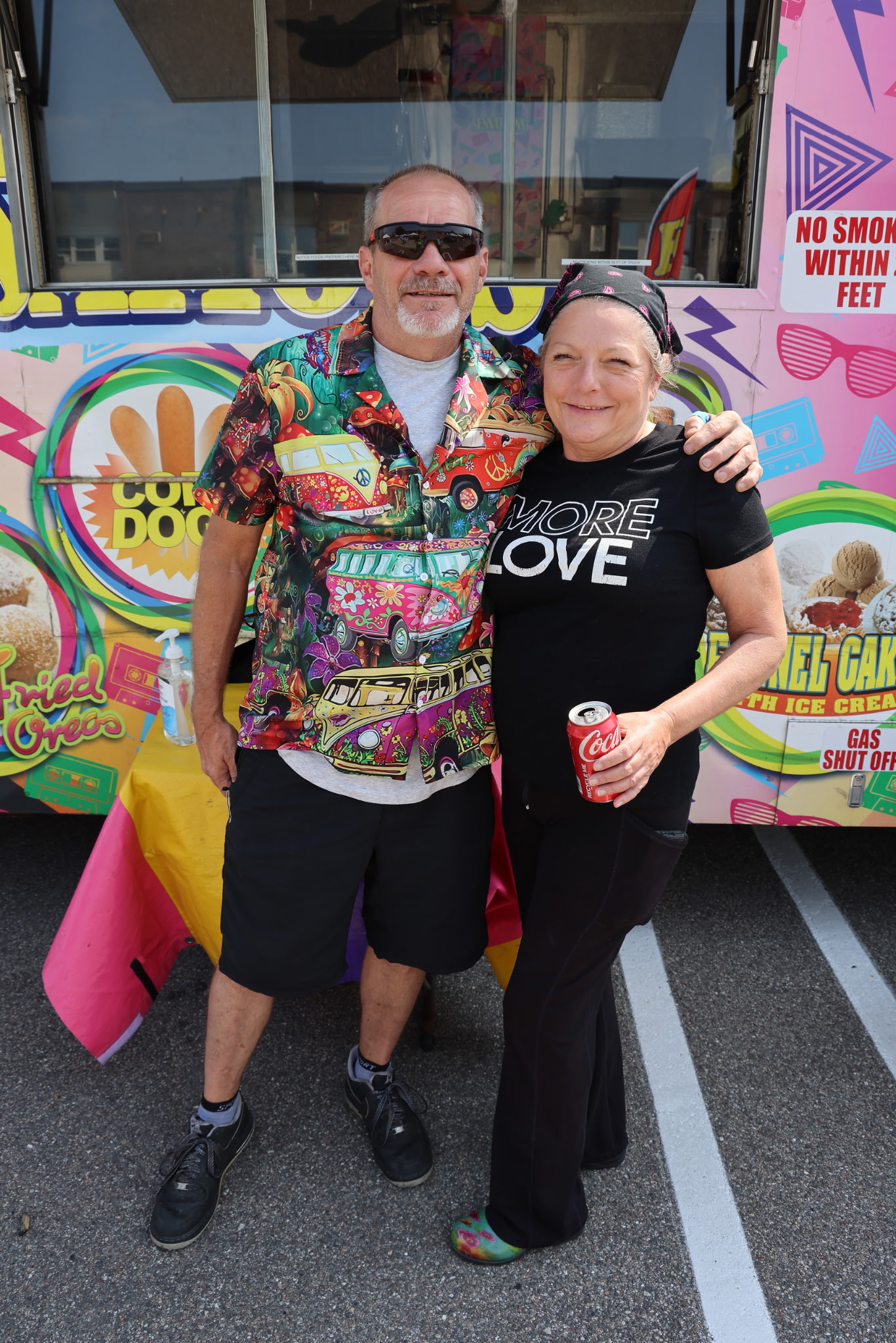 Photo of Yvette and Ray Davis in front of the Fun Food Express food truck.